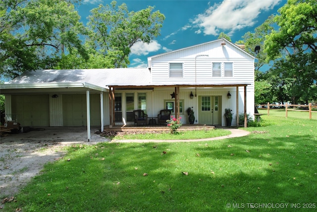 6844 Yonkipin Dr, Claremore, OK 74019 - rear view of house featuring a garage and dirt driveway