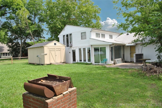 6844 Yonkipin Dr, Claremore, OK 74019 - rear view of house featuring a shed, a lawn, and a patio