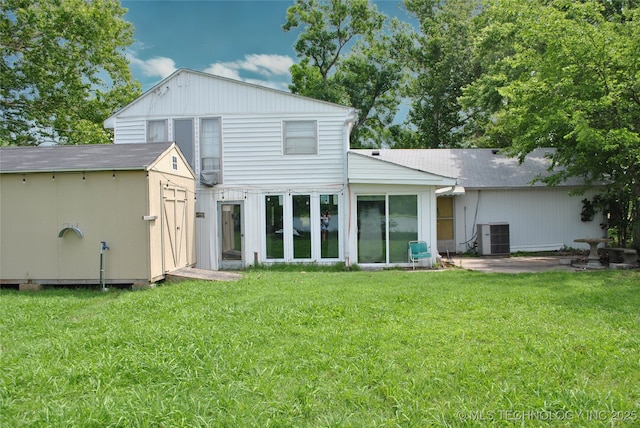 6844 Yonkipin Dr, Claremore, OK 74019 - rear view of property with a storage shed, a lawn, and roof with shingles