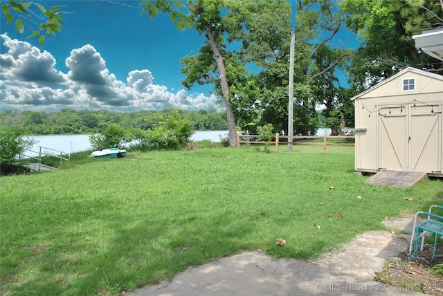 6844 Yonkipin Dr, Claremore, OK 74019 - view of grassy yard with a water view and a shed