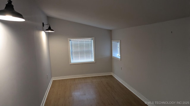 6844 Yonkipin Dr, Claremore, OK 74019 - empty room featuring wood finished floors and vaulted ceiling