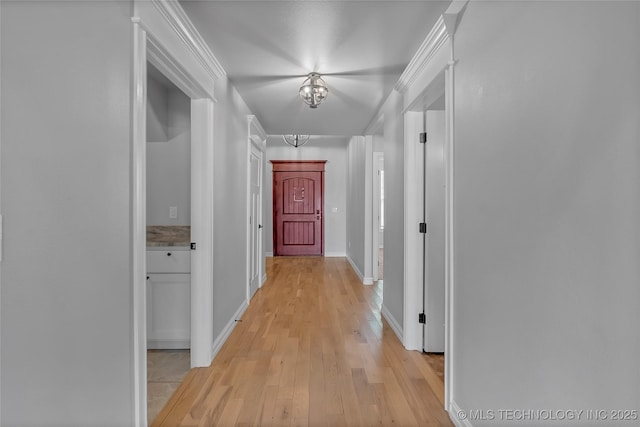 4922 S 81st W Ave, Tulsa, OK 74107 - corridor with light wood-style floors, baseboards, and a chandelier