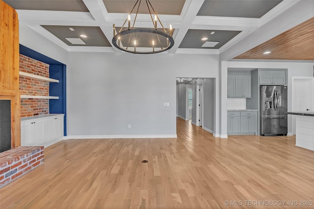 4922 S 81st W Ave, Tulsa, OK 74107 - unfurnished living room featuring coffered ceiling, light wood-style flooring, baseboards, a chandelier, and beamed ceiling