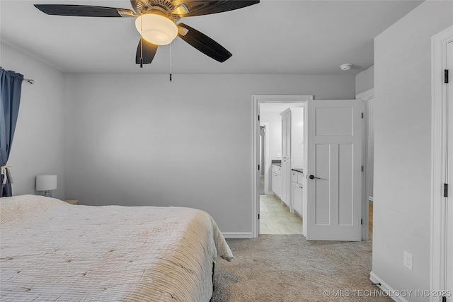 4922 S 81st W Ave, Tulsa, OK 74107 - bedroom featuring light colored carpet, ceiling fan, baseboards, and connected bathroom