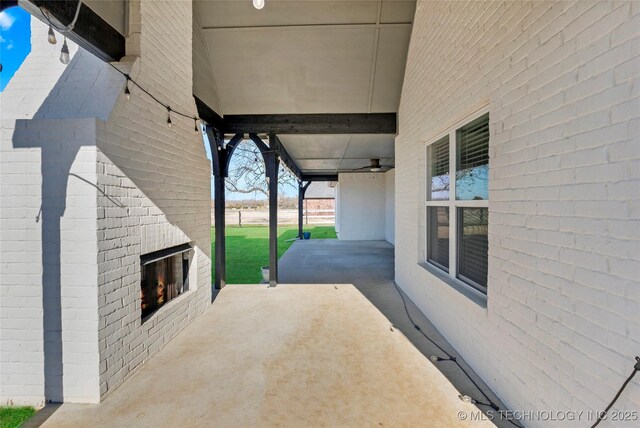 4922 S 81st W Ave, Tulsa, OK 74107 - view of patio / terrace with an outdoor brick fireplace