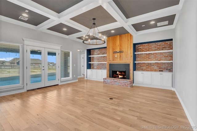 4922 S 81st W Ave, Tulsa, OK 74107 - unfurnished living room featuring light wood-style floors, baseboards, coffered ceiling, a chandelier, and beam ceiling