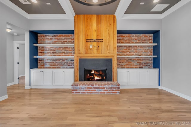 4922 S 81st W Ave, Tulsa, OK 74107 - unfurnished living room featuring a warm lit fireplace, wood finished floors, baseboards, and brick wall