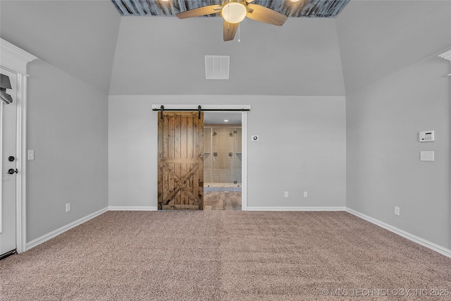4922 S 81st W Ave, Tulsa, OK 74107 - carpeted empty room featuring high vaulted ceiling, a ceiling fan, a barn door, and baseboards