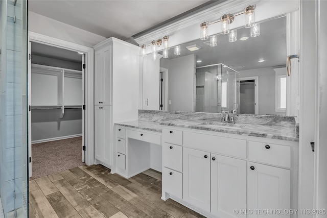 4922 S 81st W Ave, Tulsa, OK 74107 - bathroom with a shower stall, vanity, and a spacious closet