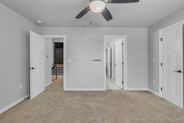 4922 S 81st W Ave, Tulsa, OK 74107 - unfurnished bedroom with carpet, baseboards, and a ceiling fan