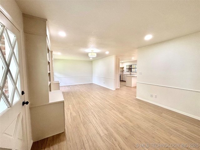 1903 Swan Ln, Mcalester, OK 74501 - unfurnished room featuring light wood-style floors, recessed lighting, healthy amount of natural light, and baseboards