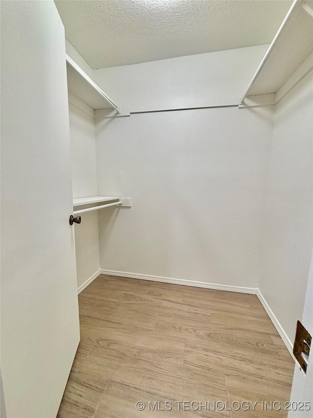 1903 Swan Ln, Mcalester, OK 74501 - walk in closet featuring light wood finished floors