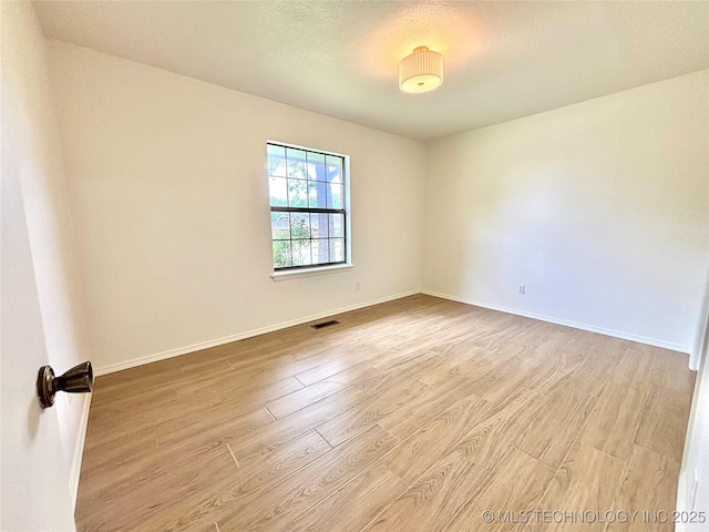 1903 Swan Ln, Mcalester, OK 74501 - unfurnished room featuring wood finished floors and baseboards