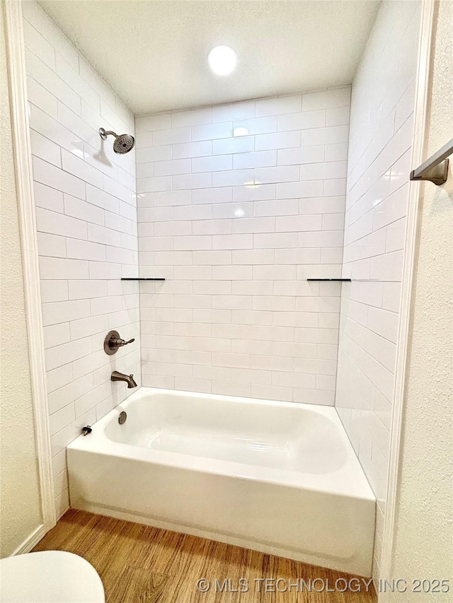 1903 Swan Ln, Mcalester, OK 74501 - full bathroom featuring wood finished floors, tub / shower combination, and toilet