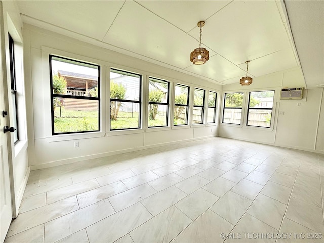 1903 Swan Ln, Mcalester, OK 74501 - unfurnished sunroom featuring an AC wall unit, lofted ceiling, baseboards, and tile patterned flooring