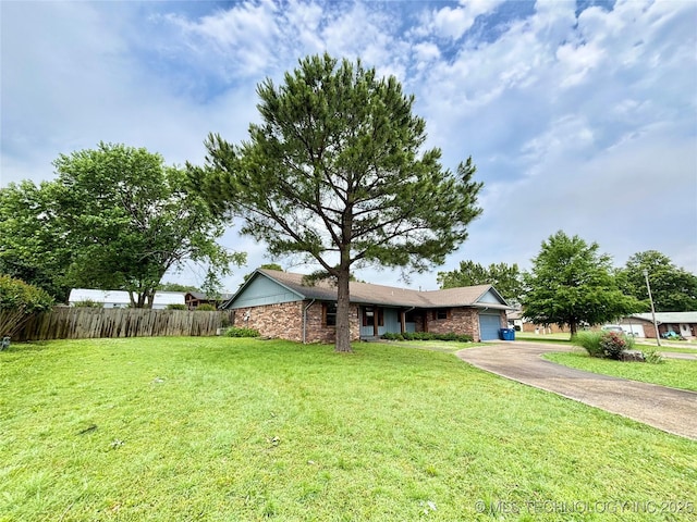 1903 Swan Ln, Mcalester, OK 74501 - ranch-style home with an attached garage, concrete driveway, and stone siding