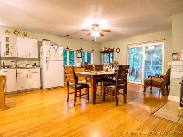 5404 Ranch Rd, Kingston, OK 73439 - dining space with a ceiling fan, light wood finished floors, and a textured ceiling