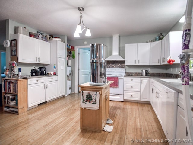 5404 Ranch Rd, Kingston, OK 73439 - kitchen featuring wall chimney range hood, white appliances, white cabinetry, and light wood-style flooring