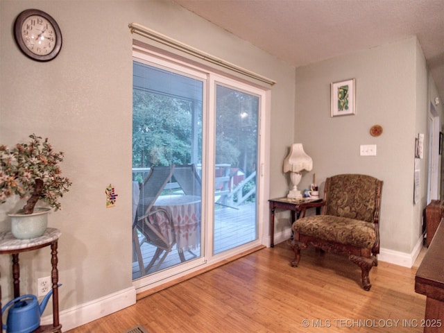 5404 Ranch Rd, Kingston, OK 73439 - sitting room featuring wood finished floors and baseboards