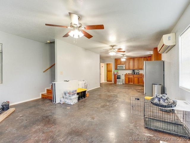 1533 County Road 3480, Ada, OK 74820 - unfurnished living room with a wall unit AC, concrete floors, a ceiling fan, stairway, and baseboards