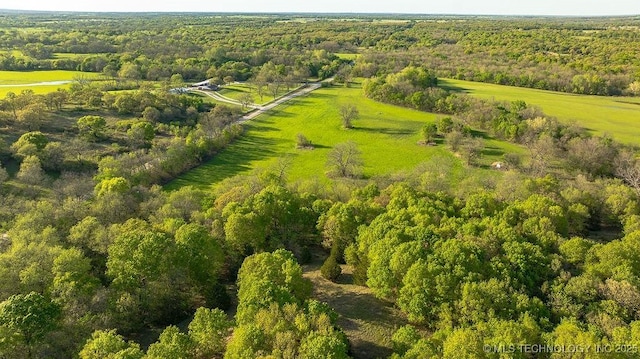 1533 County Road 3480, Ada, OK 74820 - aerial overview of property's location with a heavily wooded area