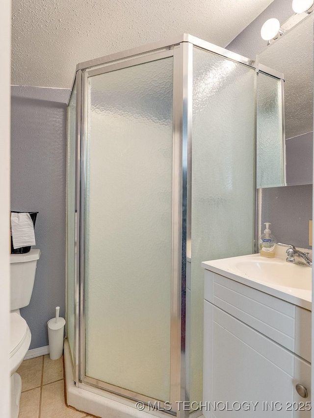 1533 County Road 3480, Ada, OK 74820 - full bath with vanity, toilet, a stall shower, and tile patterned flooring