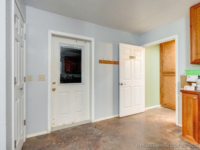 1533 County Road 3480, Ada, OK 74820 - entryway with concrete floors and baseboards