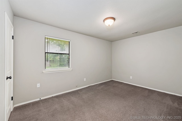 202 NE B St NE, Inola, OK 74036 - unfurnished room featuring dark colored carpet and baseboards