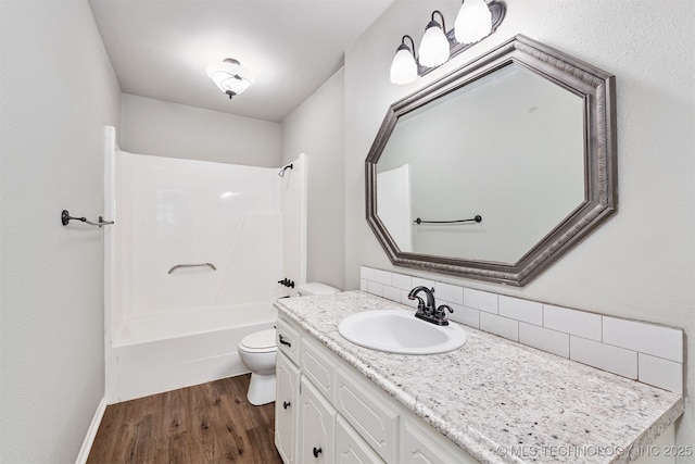 202 NE B St NE, Inola, OK 74036 - full bathroom featuring decorative backsplash, wood finished floors, toilet, vanity, and shower / bathtub combination