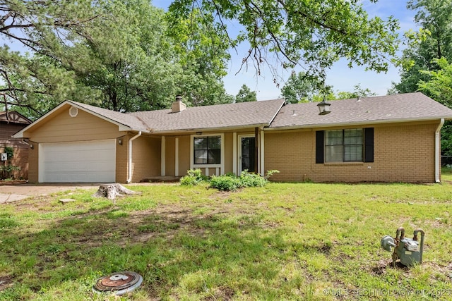 202 NE B St NE, Inola, OK 74036 - single story home featuring a garage, brick siding, a chimney, a front yard, and driveway