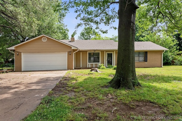 202 NE B St NE, Inola, OK 74036 - ranch-style home featuring a garage, a chimney, concrete driveway, brick siding, and a front lawn