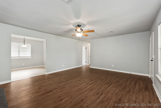 202 NE B St NE, Inola, OK 74036 - empty room with ceiling fan, wood finished floors, and baseboards