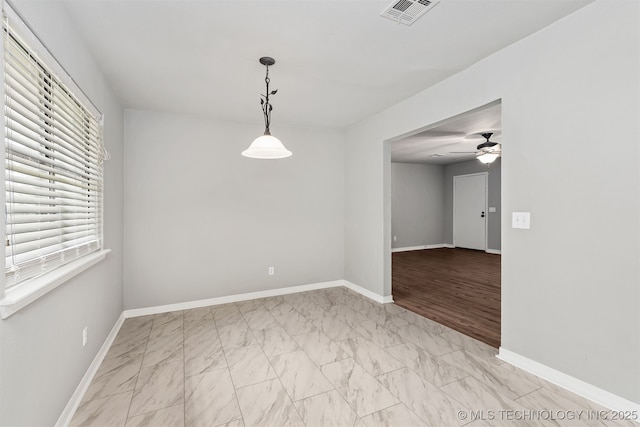 202 NE B St NE, Inola, OK 74036 - spare room featuring light marble finish flooring, baseboards, and ceiling fan