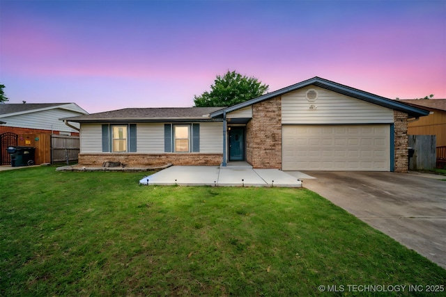 2910 S Main St, Sapulpa, OK 74066 - view of front facade featuring brick siding, driveway, and a garage