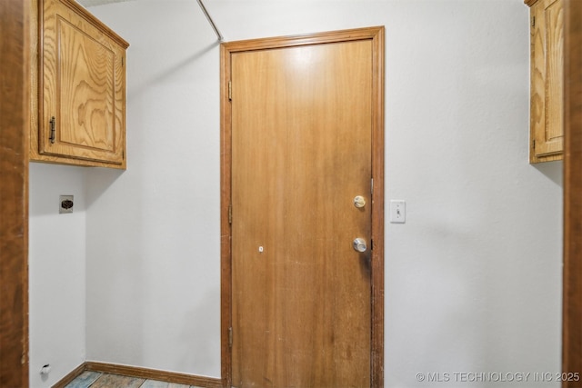 2910 S Main St, Sapulpa, OK 74066 - laundry area with cabinet space, hookup for an electric dryer, and baseboards