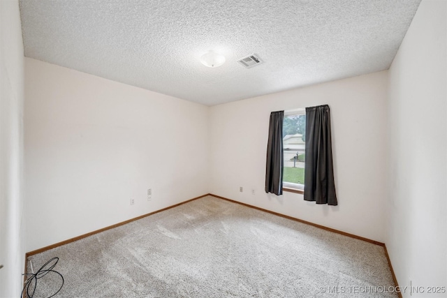 2910 S Main St, Sapulpa, OK 74066 - spare room with carpet, baseboards, and a textured ceiling