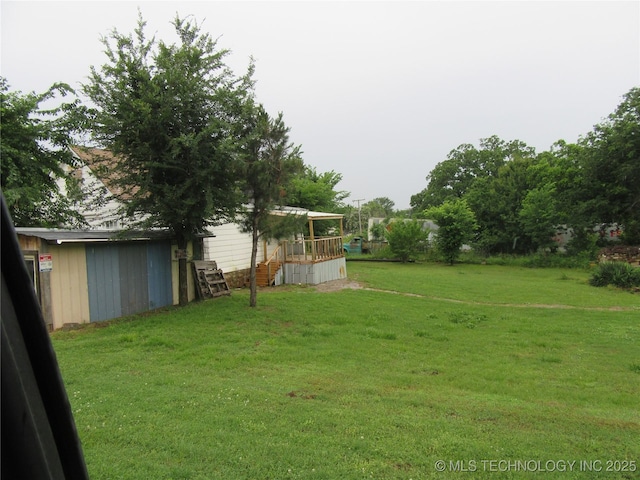 1000 N 6th, Quinton, OK 74561 - view of green lawn featuring a deck and stairs