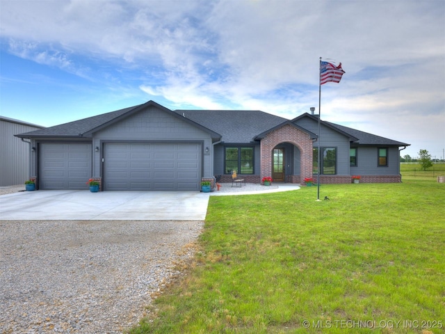 8859 N 50th W Ave, Sperry, OK 74073 - view of front facade featuring driveway, a garage, a front lawn, and roof with shingles