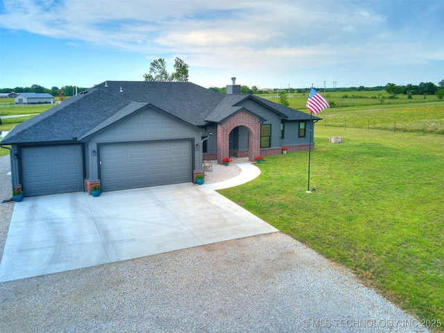 8859 N 50th W Ave, Sperry, OK 74073 - single story home with an attached garage, concrete driveway, a chimney, brick siding, and a shingled roof