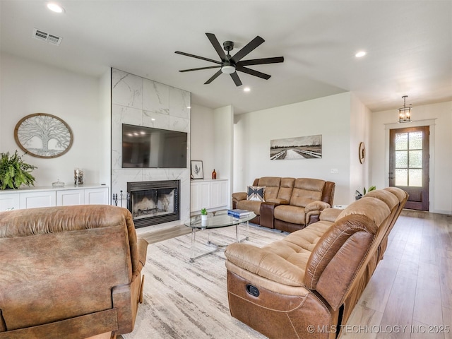 8859 N 50th W Ave, Sperry, OK 74073 - living room featuring light wood finished floors, ceiling fan, a fireplace, and recessed lighting
