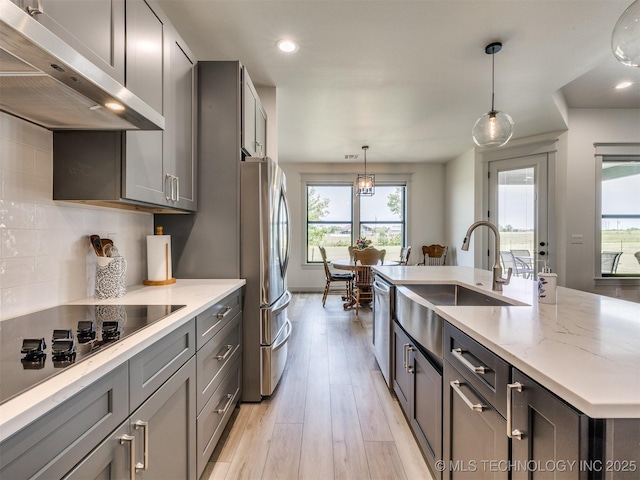 8859 N 50th W Ave, Sperry, OK 74073 - kitchen featuring ventilation hood, a sink, appliances with stainless steel finishes, healthy amount of natural light, and recessed lighting