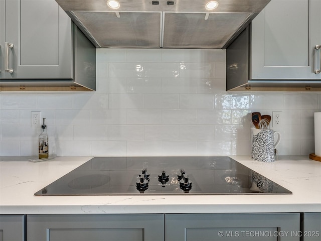 8859 N 50th W Ave, Sperry, OK 74073 - kitchen with gray cabinetry and tasteful backsplash
