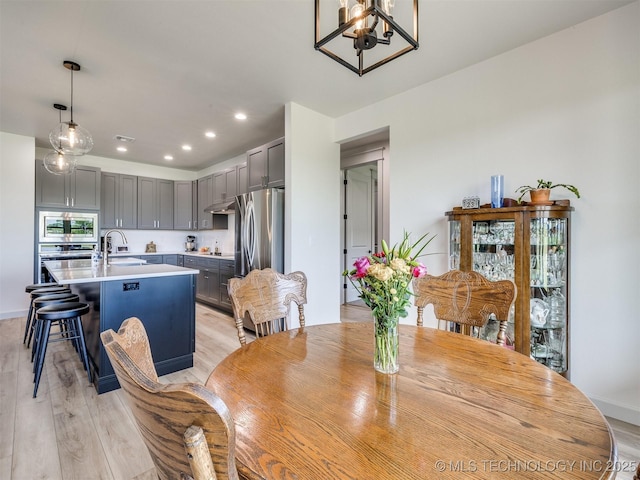 8859 N 50th W Ave, Sperry, OK 74073 - dining room featuring a chandelier, light wood finished floors, and recessed lighting