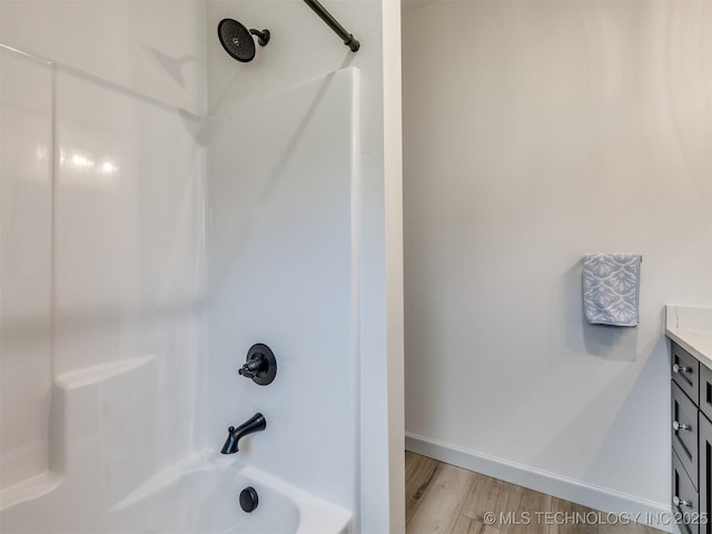 8859 N 50th W Ave, Sperry, OK 74073 - bathroom with vanity, shower / bathtub combination, and wood finished floors
