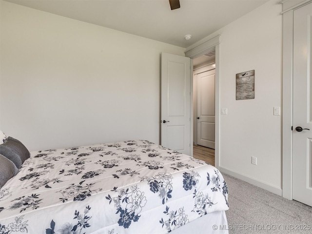 8859 N 50th W Ave, Sperry, OK 74073 - bedroom featuring baseboards, light carpet, and a ceiling fan