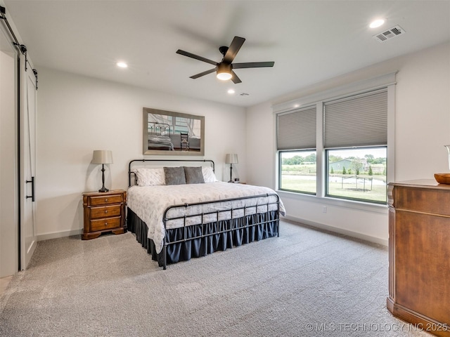 8859 N 50th W Ave, Sperry, OK 74073 - bedroom with carpet flooring, recessed lighting, baseboards, a barn door, and ceiling fan