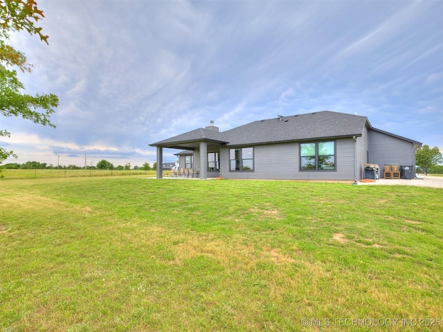 8859 N 50th W Ave, Sperry, OK 74073 - rear view of property featuring a lawn and a patio