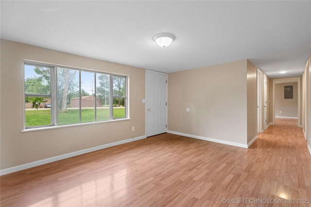 607 E Schley St, Vian, OK 74962 - spare room featuring baseboards and light wood finished floors