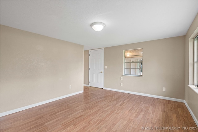 607 E Schley St, Vian, OK 74962 - spare room featuring light wood-type flooring and baseboards