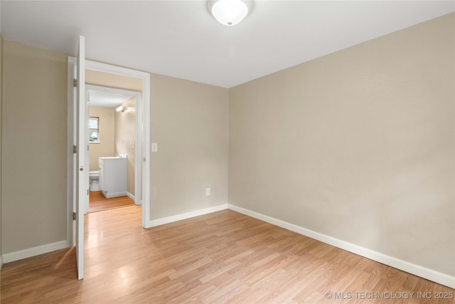 607 E Schley St, Vian, OK 74962 - spare room featuring light wood-style flooring and baseboards